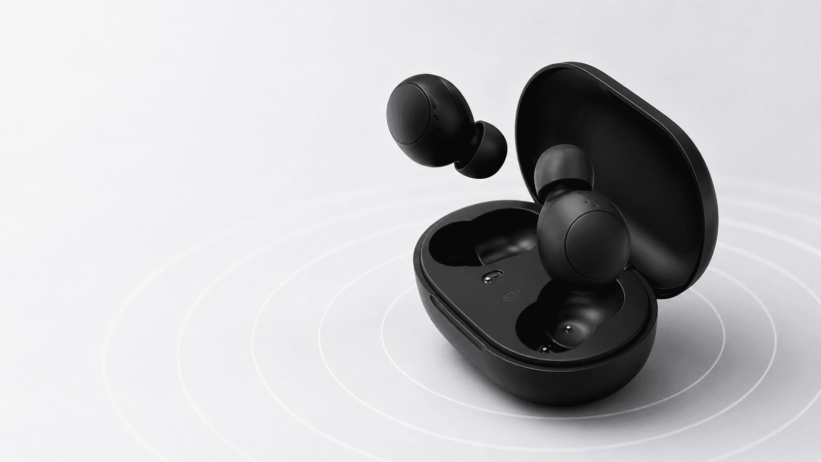 Black wireless earbuds and open charging case